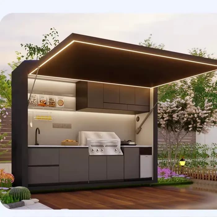 Cuisine de jardin avec armoires modulaires et îlot de gril
